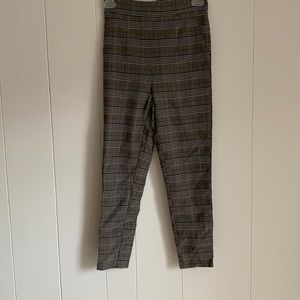 Size small straight leg black, gray, white, and orange plaid pants.